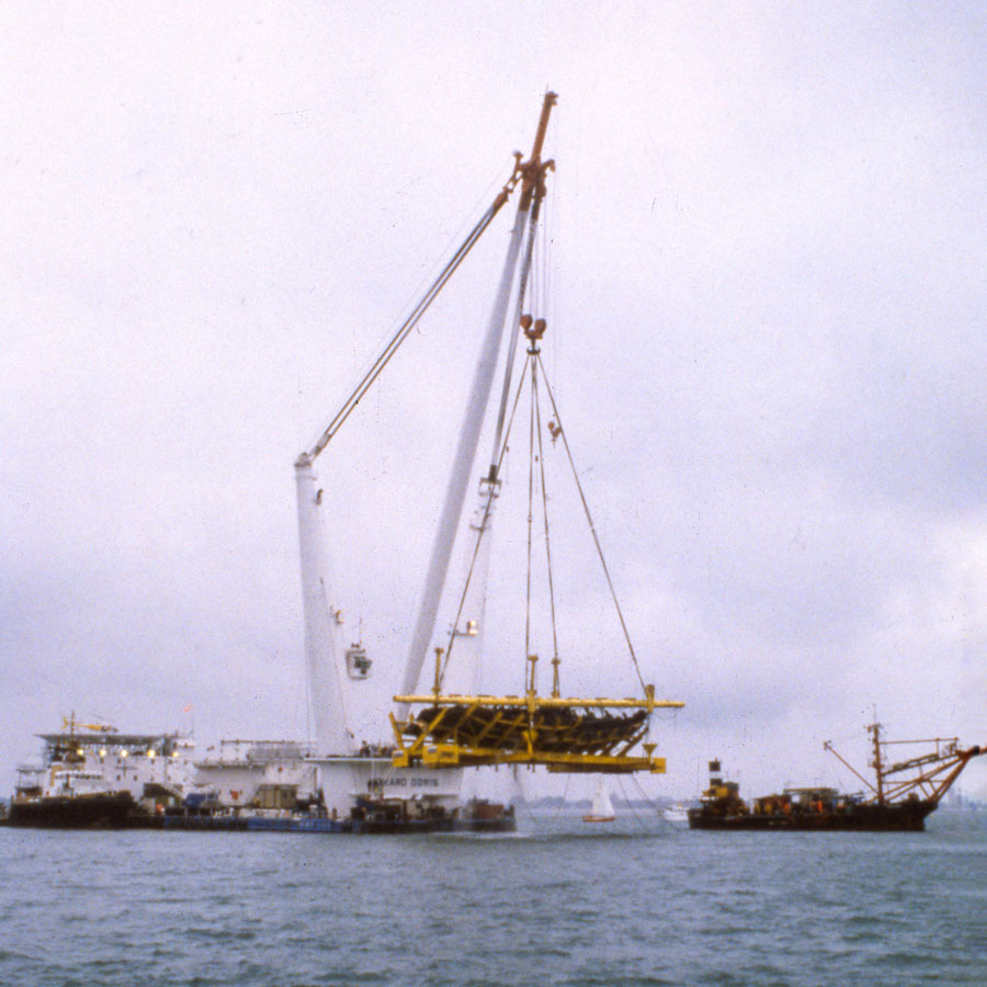 The Mary Rose being raised by Tog Mor, a giant floating white crane on the surface of the Solent.